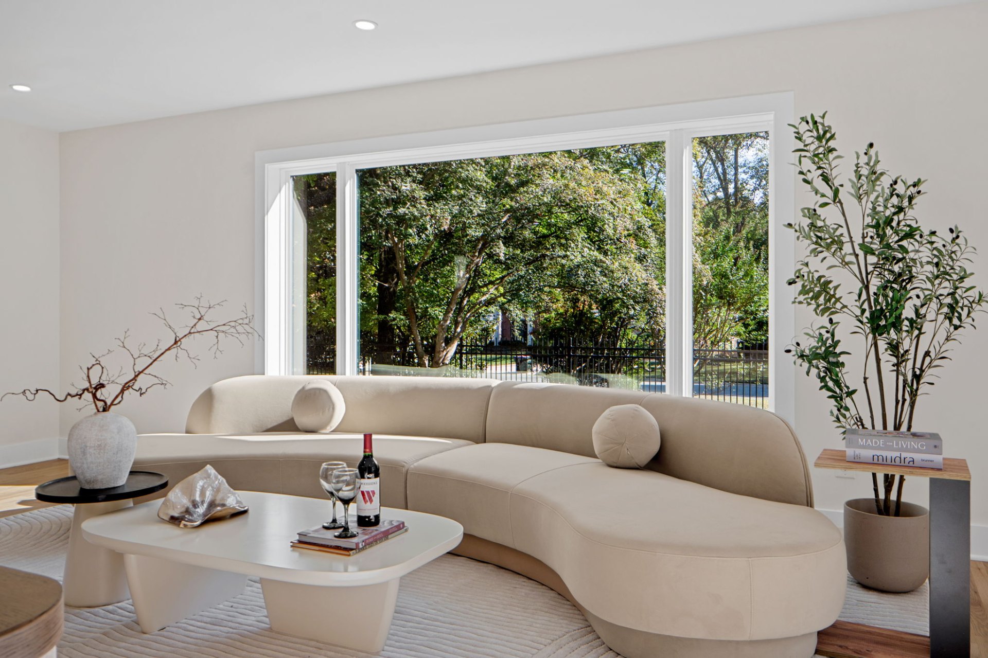 Living Room – Curved Sofa & Garden View